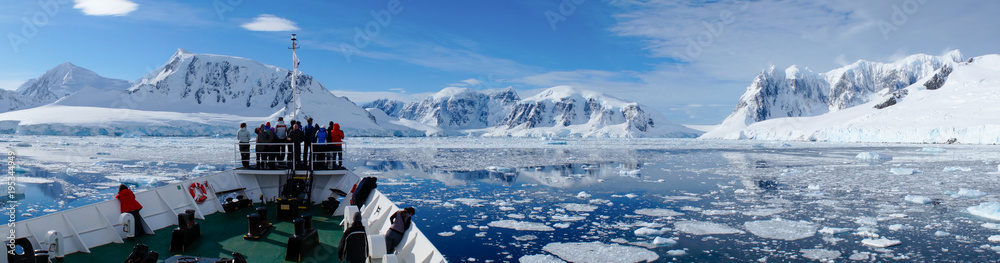 Cruising through the Neumayer channel full of Icebergs in Antarctica. - obrazy, fototapety, plakaty 