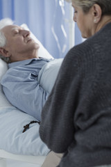 Wall Mural - Woman praying at hospital