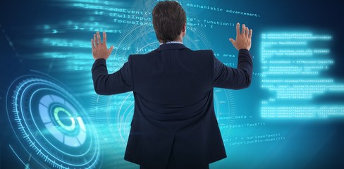 Poster - Composite image of businessman touching the invisible screen
