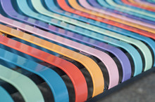 Closeup Of Colorful Metallic Bench In The Street