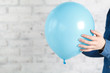 © Andrey Cherkasov - Blue balloon in female hands