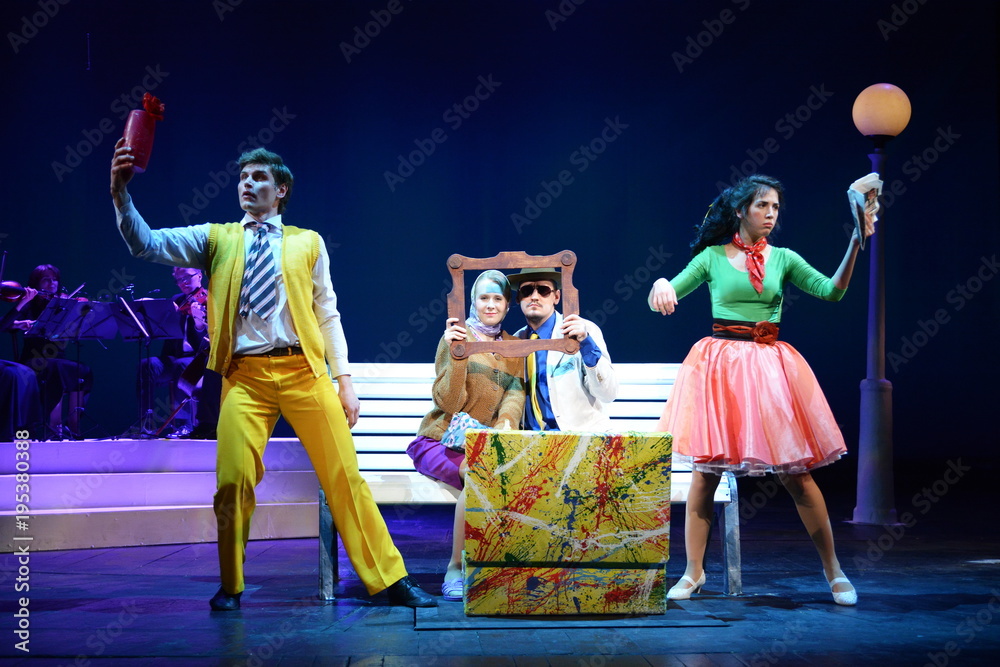 Young performers dancing on theater stage