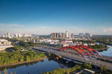 Wall Mural - HO CHI MINH, VIETNAM - NOV 20, 2017: Royalty high quality stock image aerial view of Ho Chi Minh city, Vietnam. Beauty skyscrapers along river light smooth down urban development in Ho Chi Minh City