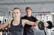© rkm Premium - Junge Frau beim Workout mit Hanteln
