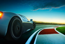 3D Rendering Of A Brand-less Grey Sport Car With  Motion Blur . Race Track Background . Sunset Scene .