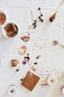 Dirty table after cooking and eating ice cream: drops, sprinkles, berries. The concept of mess, dirty dishes.