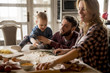 © BGStock72 - Happy family making pasta in the kitchen at home