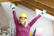 © epiximages - blond, beautiful woman is overjoyed with the idea to expand the loft