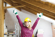 © epiximages - blond, beautiful woman is overjoyed with the idea to expand the loft