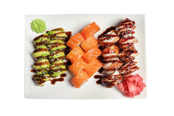 Wall Mural - Plate with set of delicious sushi rolls on white background