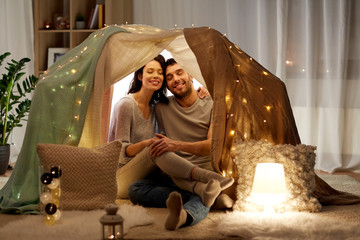 Canvas Print - happy couple in kids tent at home