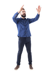Wall Mural - Cheerful cheering happy young business casual man clapping hands looking up and smile. Full body isolated on white background. 