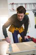 © Wavebreak Media - Male carpenter painting a table