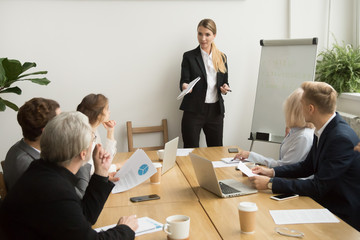 Poster - Successful businesswoman giving presentation to business team, female ceo leader coaching teaching on corporate training, woman boss talking planning explaining answering questions at group meeting