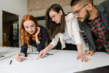 Wall Mural - Explaining the drawings to the project manager at the office