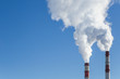 © Viktor Iden - Air pollution. Factory pipes with smoke in the blue sky. Ecology problem