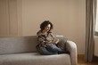 © Wavebreak Media - Woman using digital tablet in living room