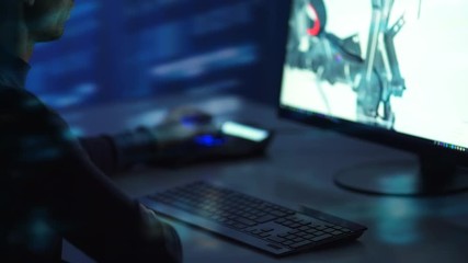 The man working with a 3d graphic. evening night time