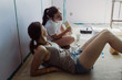 © Tana Teel Photography/Stocksy - teenagers being funny while taking a lunch break during painting