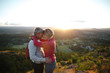 © Rob and Julia Campbell/Stocksy - Fit, active middle age couple hiking together at sunset