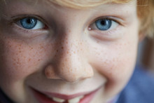 Portrait Of A Child With Freckles