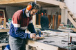 © VISUALSPECTRUM/Stocksy - Picture Frame Making - Young Male Carpenter Applying Glue With Brush