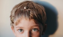 Blond Boy's Eyes And Hair With Little Snails