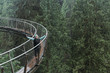 © Preappy/Stocksy - Happy woman on skywalk
