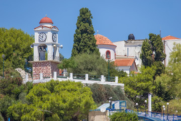 Agios Nikolaos church with clock tower on the Skiathos island, Greece