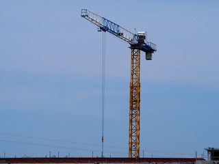 A crane against a blue sky background