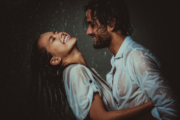 couple sharing romantic moments under the rain