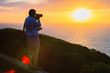 © Roman Babakin - Man taking photos of sunset at Portoscuso Carbonia Sardinia