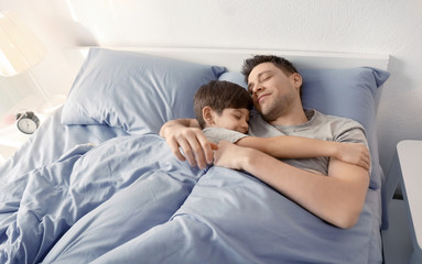 Poster - Father with son sleeping in bed at home