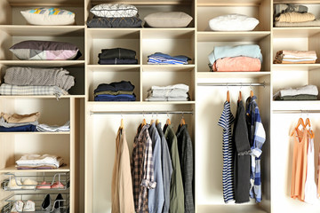 Wall Mural - Large wardrobe closet with different clothes, shoes and home stuff