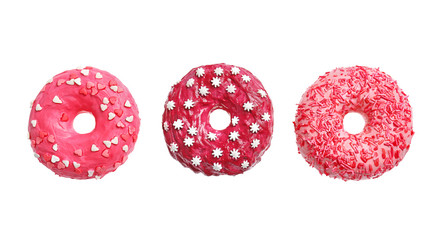 Wall Mural - Delicious pink donuts on white background