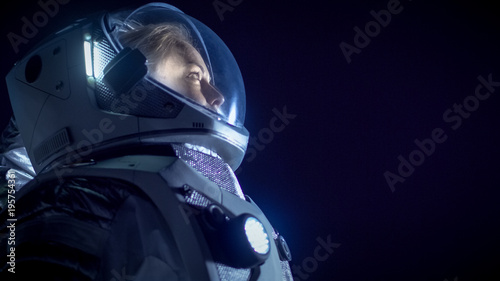 Portrait of the Beautiful Female Astronaut Space Walking, Looking around in Wonder Fototapeta