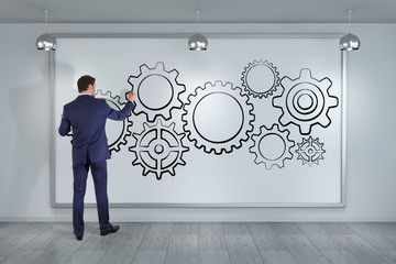 Poster - Businessman drawing gears sketch on a board 3D rendering
