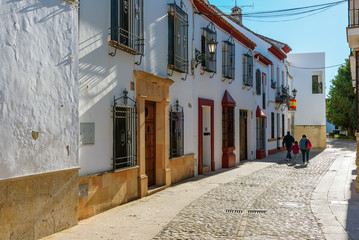 Naklejka na meble Strret with traditional Spanish old architecture in Ronda town, Spain
