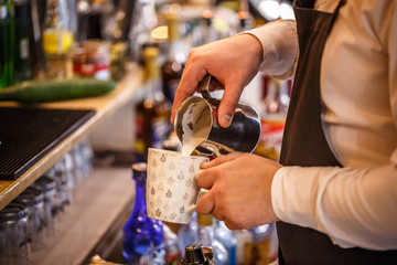 Wall Mural - Barista making cappuccino.