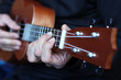 close up ukulele in musician hands