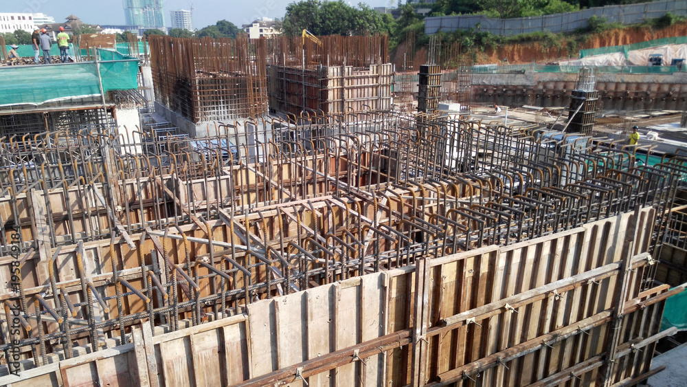 Construction workers fabricated timber formwork and reinforcement bar ...
