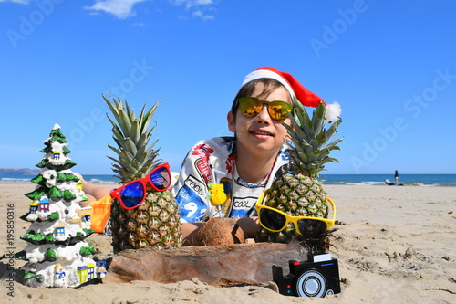 christmas boy with hipster fruits