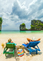 Canvas Print - Couple on the beach at tropical resort Travel