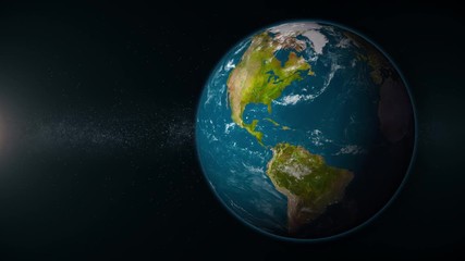 Wall Mural - a view of mother earth rotating in deep space. looping. off set right with sunlight on left of scree