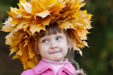 Girl with a wreath of maple leaves on her head