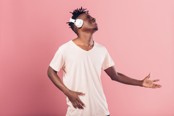 Wall Mural - African-American man in headphones listening to music