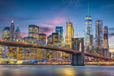 Fototapeta Miasta - New York City, USA skyline on the East River with Brooklyn Bridge at dusk.