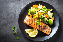 Grilled Salmon Fillet With Vegetables Mix. 