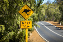 A Kangaroo Crossing Road Sign Warns Drivers In Western Australia Of The Potential Wildlife Hazards Ahead