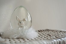 A Snowglobe Is A Container Of Glass Or Plastic Filled With Water, In Which There Are Also Small Particles (bunny) That Stir When Shaken And Then Slowly Settle Like Snow